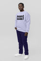 Person wearing a white sweatshirt with &