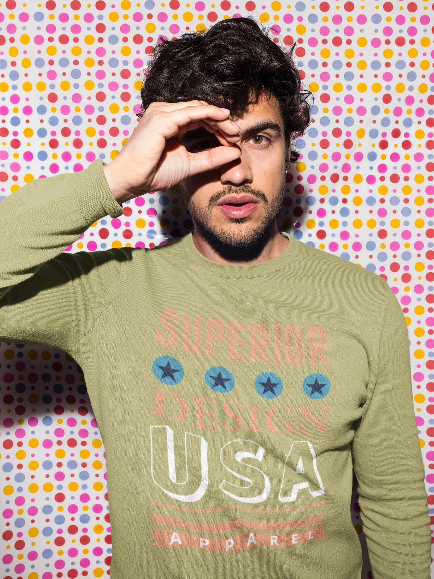 Man wearing a green sweatshirt with &
