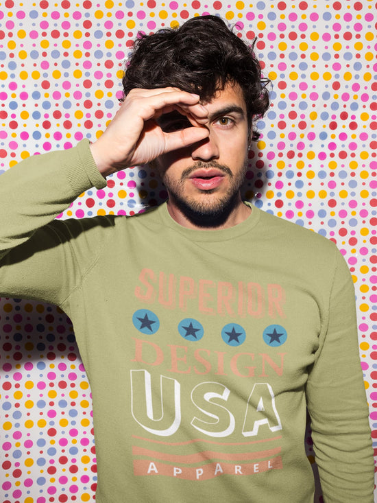 Man wearing a green sweatshirt with &