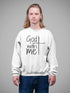 Person wearing a white sweatshirt with &