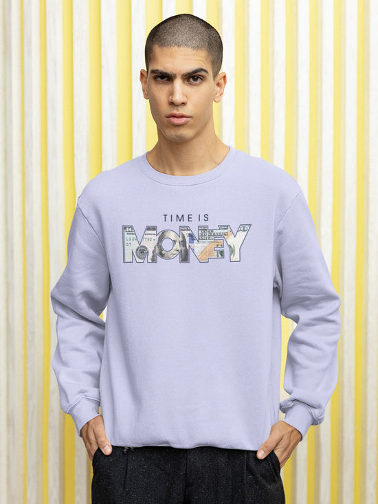 Person wearing a light blue sweatshirt with &