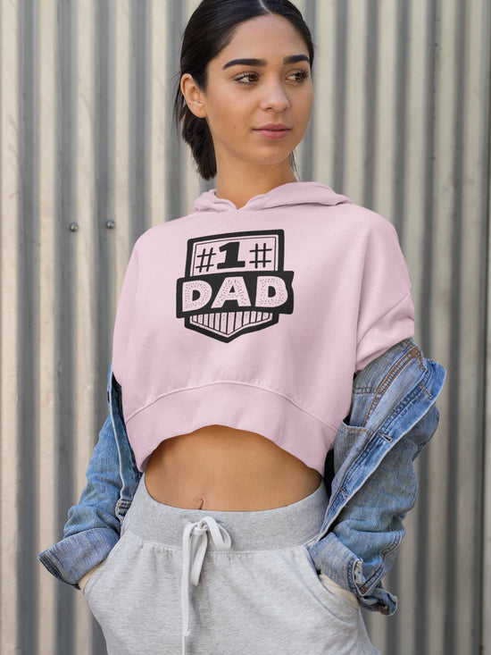 Woman wearing a pink hoodie with &
