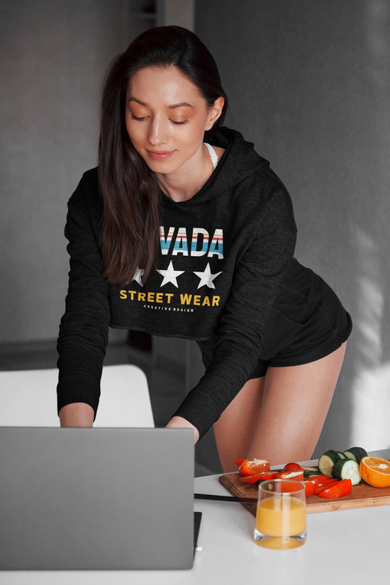 Woman wearing a black hoodie with &