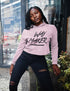 Person wearing a pink hoodie with &