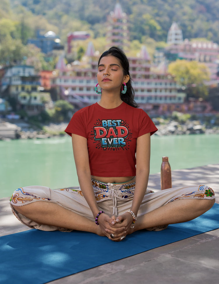 Person meditating on a yoga mat with a scenic background