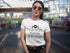 Woman wearing a white t-shirt with &