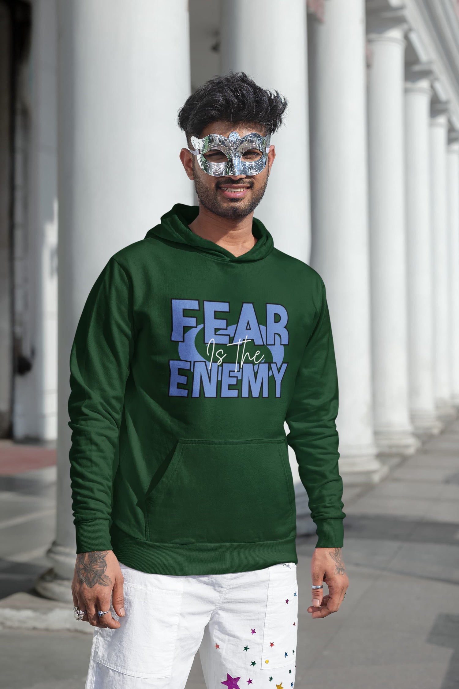 Man wearing a green hoodie with &