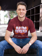 Man wearing a maroon t-shirt with 'Retro Future' design sitting outdoors.