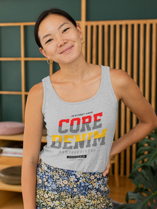 Woman wearing a gray tank top with &