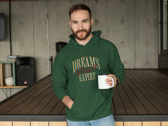 Man wearing a green hoodie with &