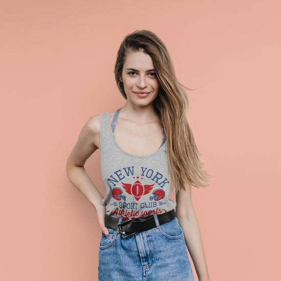 Woman wearing a gray tank top with &