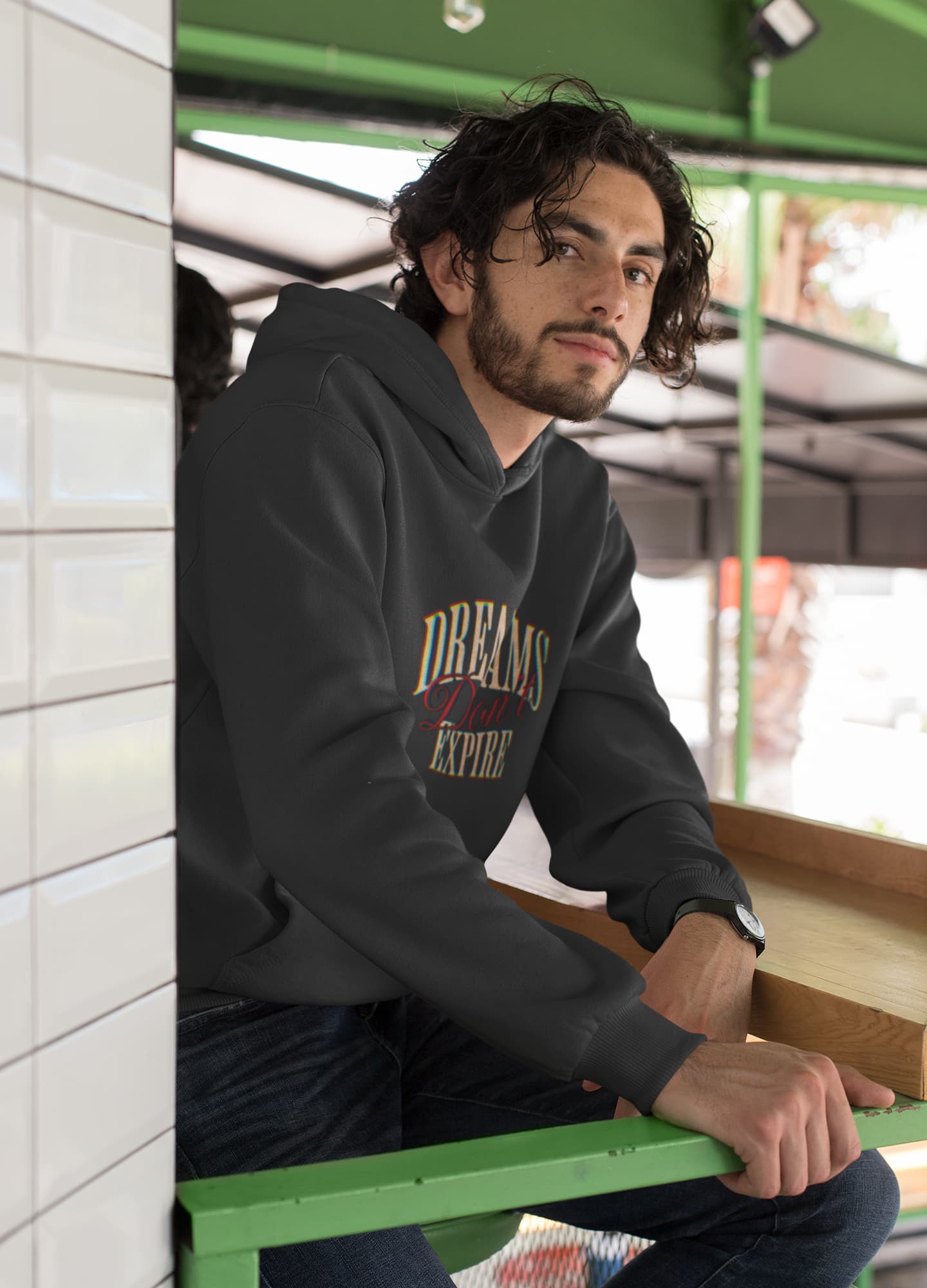 Man wearing a hoodie with &