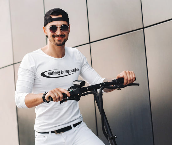 Man holding a scooter with &