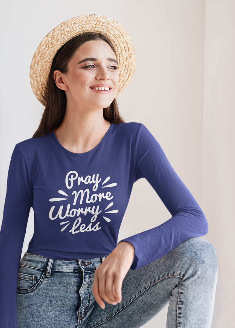 Woman wearing a blue long-sleeve shirt with &