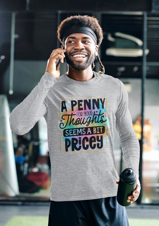 Man wearing a gray long-sleeve shirt with colorful text design, talking on a phone indoors.