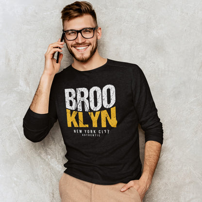 Man wearing a black sweatshirt with &