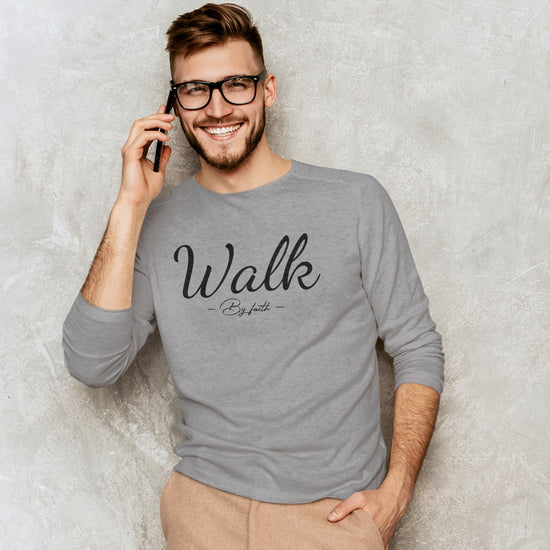 Man wearing a gray sweatshirt with &