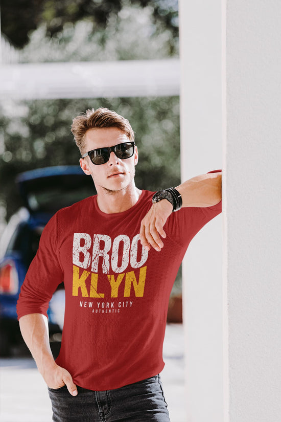 Man wearing a red t-shirt with &