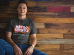Person wearing a 'Retro Future' t-shirt sitting against a wooden wall.