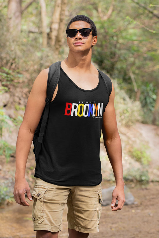 Man wearing a black tank top with &