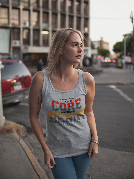 Woman wearing a tank top with text on a street background