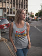 Woman wearing a tank top with text on a street background
