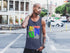 Man wearing a tank top with colorful graphics on a city street