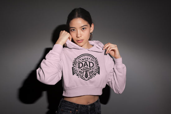 Woman wearing a pink hoodie with &