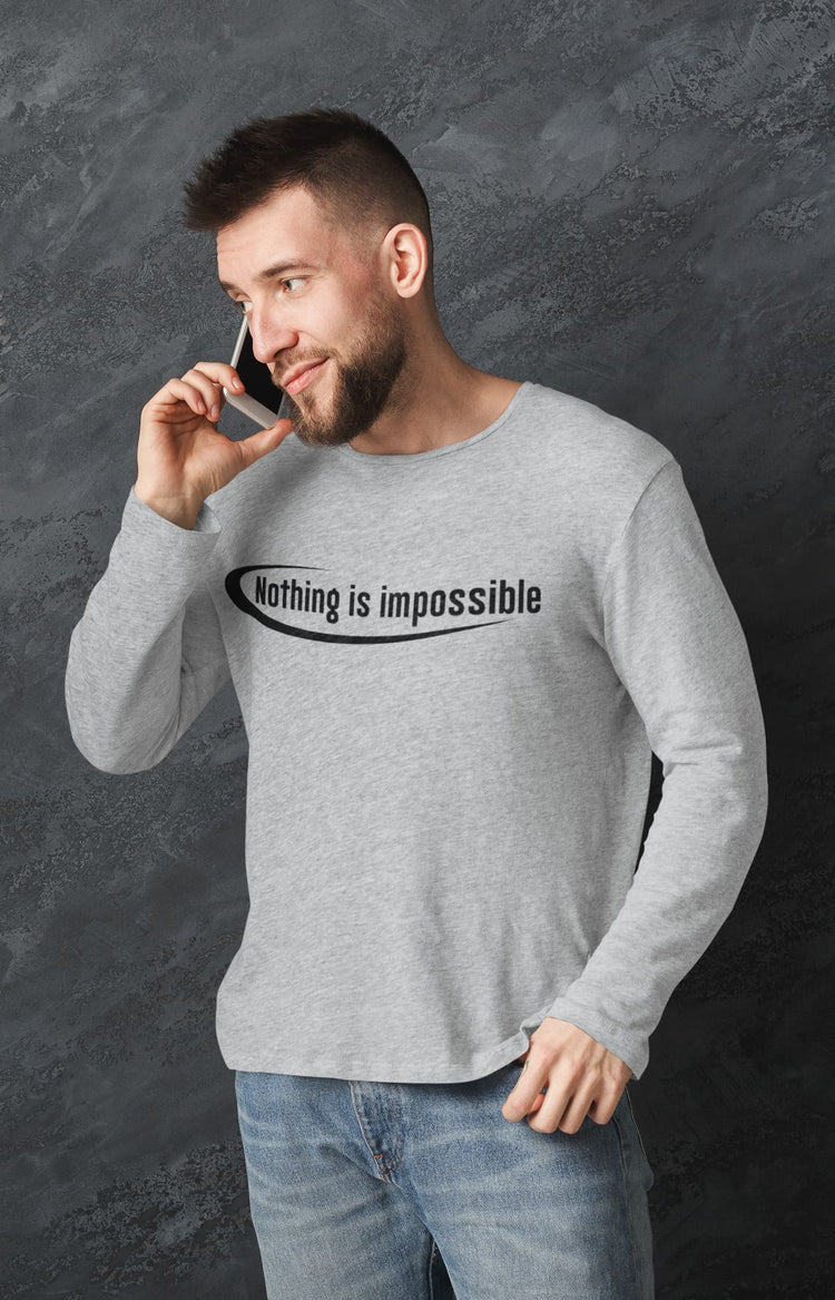 Man wearing a gray sweatshirt with &