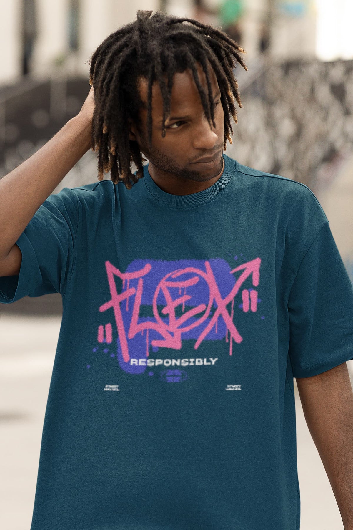 Person wearing a teal t-shirt with pink and purple 'Flex Responsibly' graphic design.