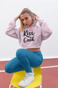 Woman wearing a pink hoodie with &
