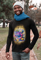 Man wearing a black long-sleeve shirt with a colorful graphic and text, standing outdoors.