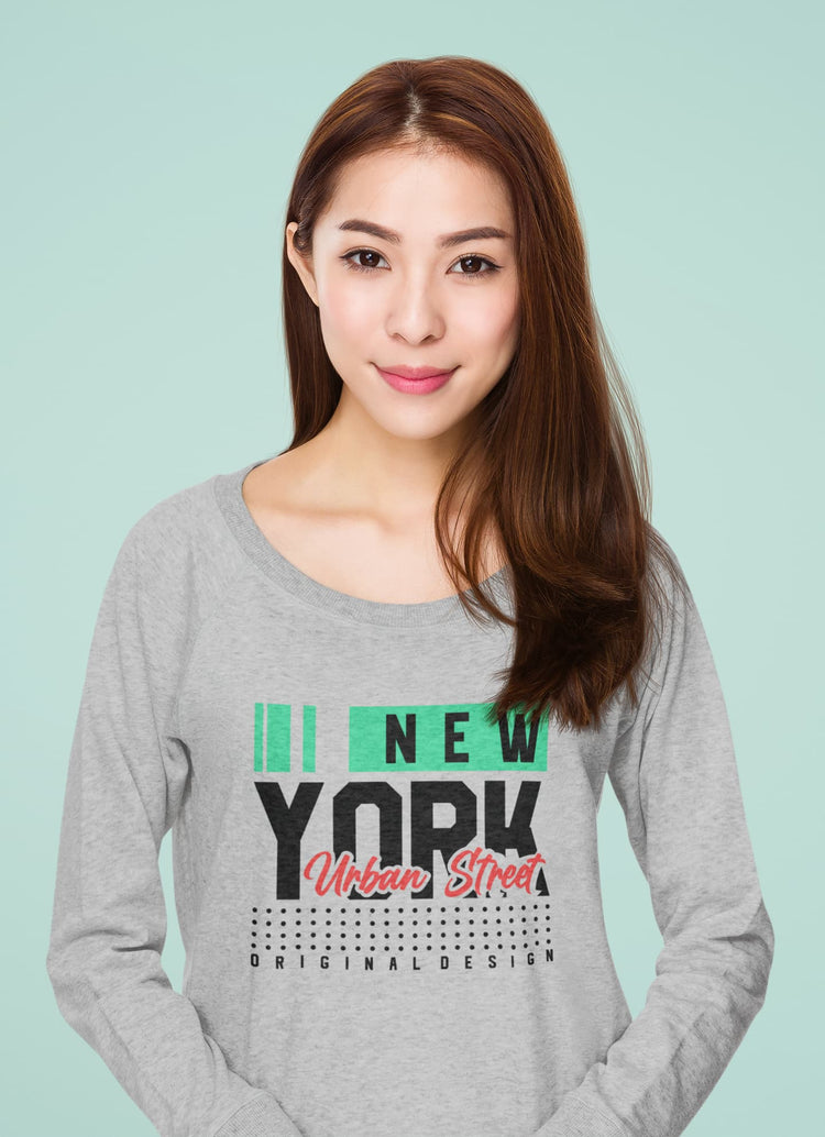 Woman wearing a gray sweatshirt with &