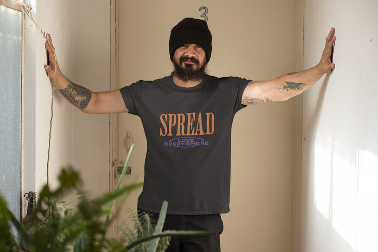 Person wearing a black t-shirt with &