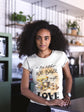Woman wearing a t-shirt with a bakery-themed design in a kitchen setting
