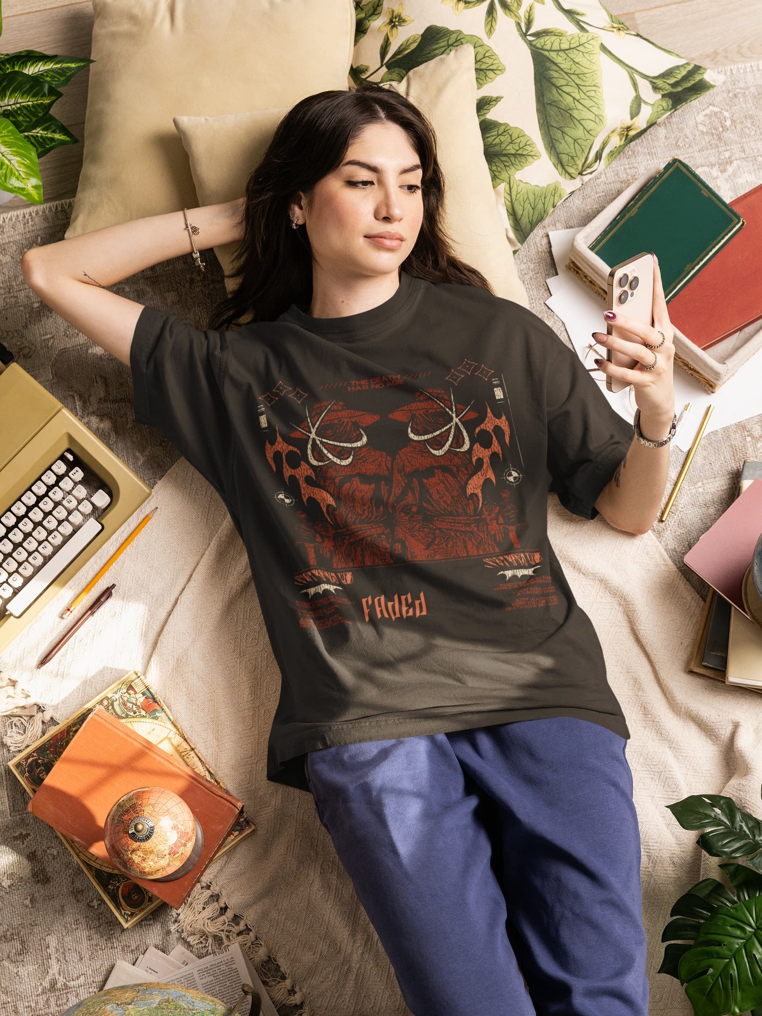 Woman wearing a black t-shirt with red graphics in a casual setting