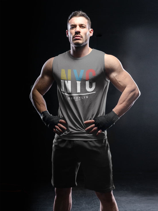 Man wearing a gray sleeveless shirt with &