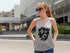 Woman wearing a gray tank top with &