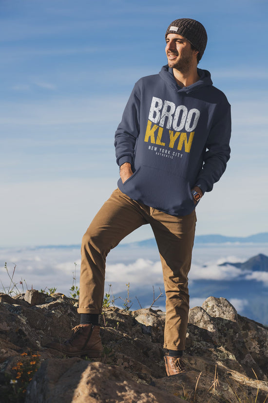 Person wearing a hoodie with &