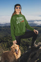 Person wearing a green hoodie with &