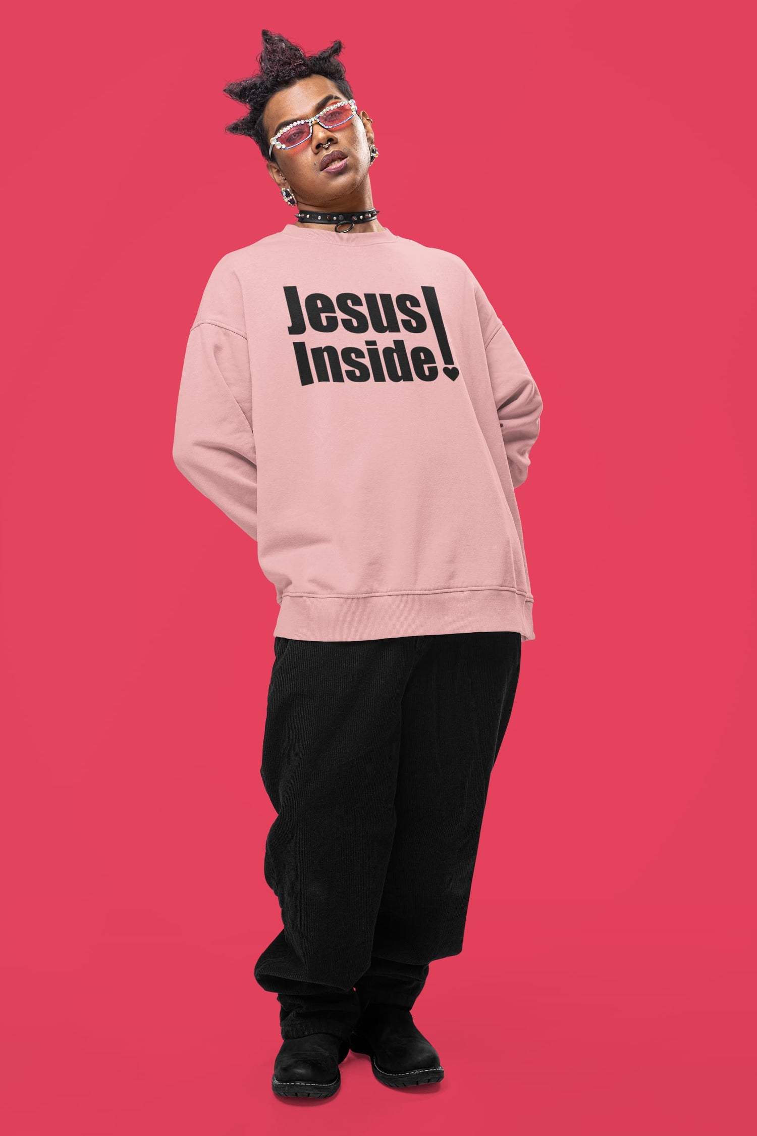 Person wearing a pink sweatshirt with &