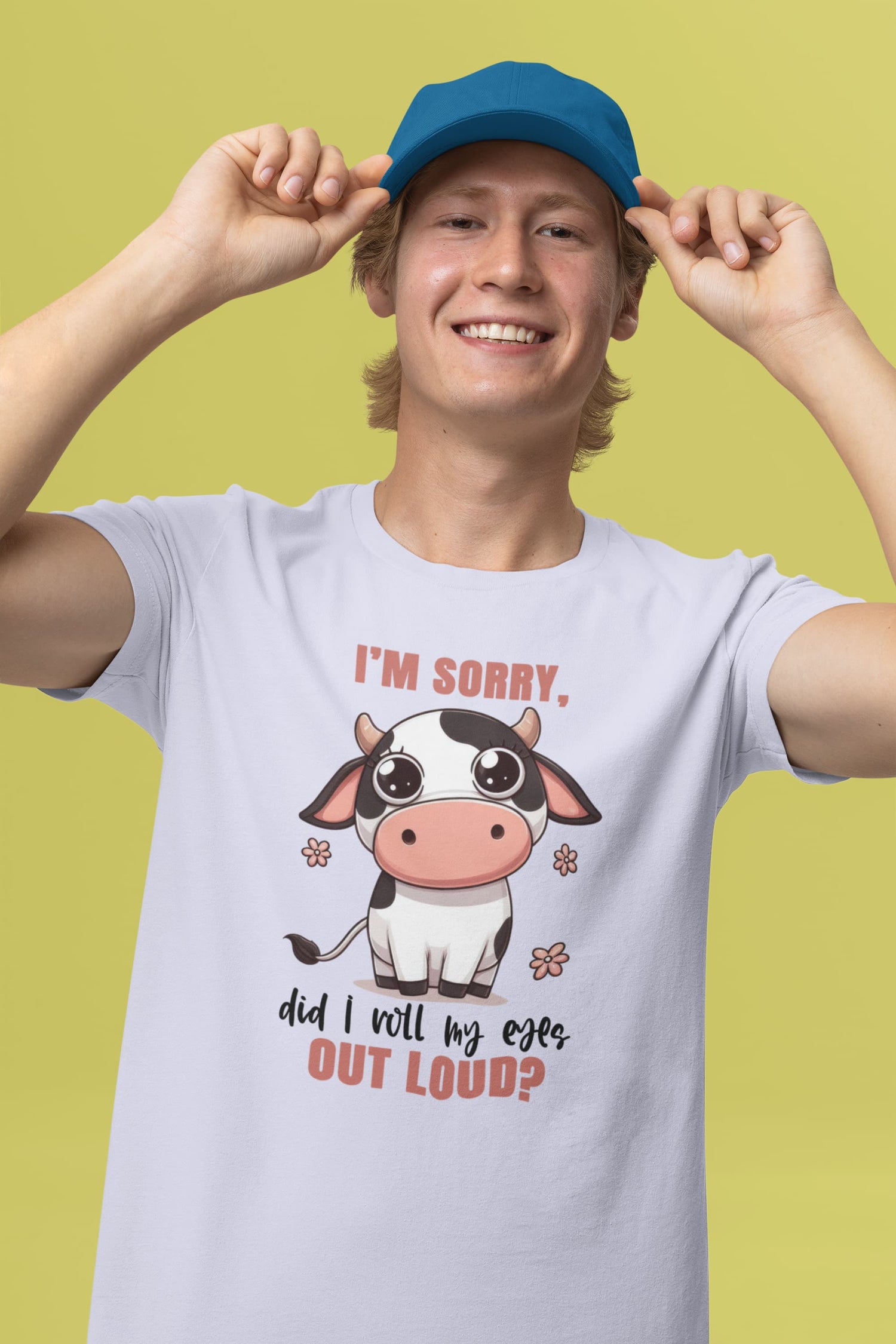 Person wearing a t-shirt with a cow graphic and text on a green background