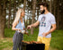 Man and woman grilling outdoors in a forest setting