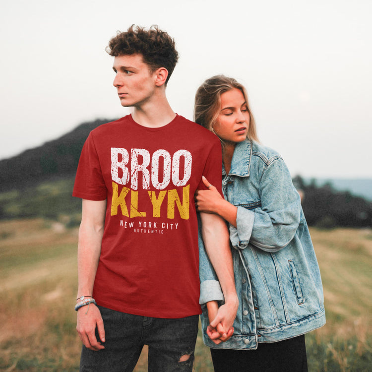 Man wearing a red t-shirt with &