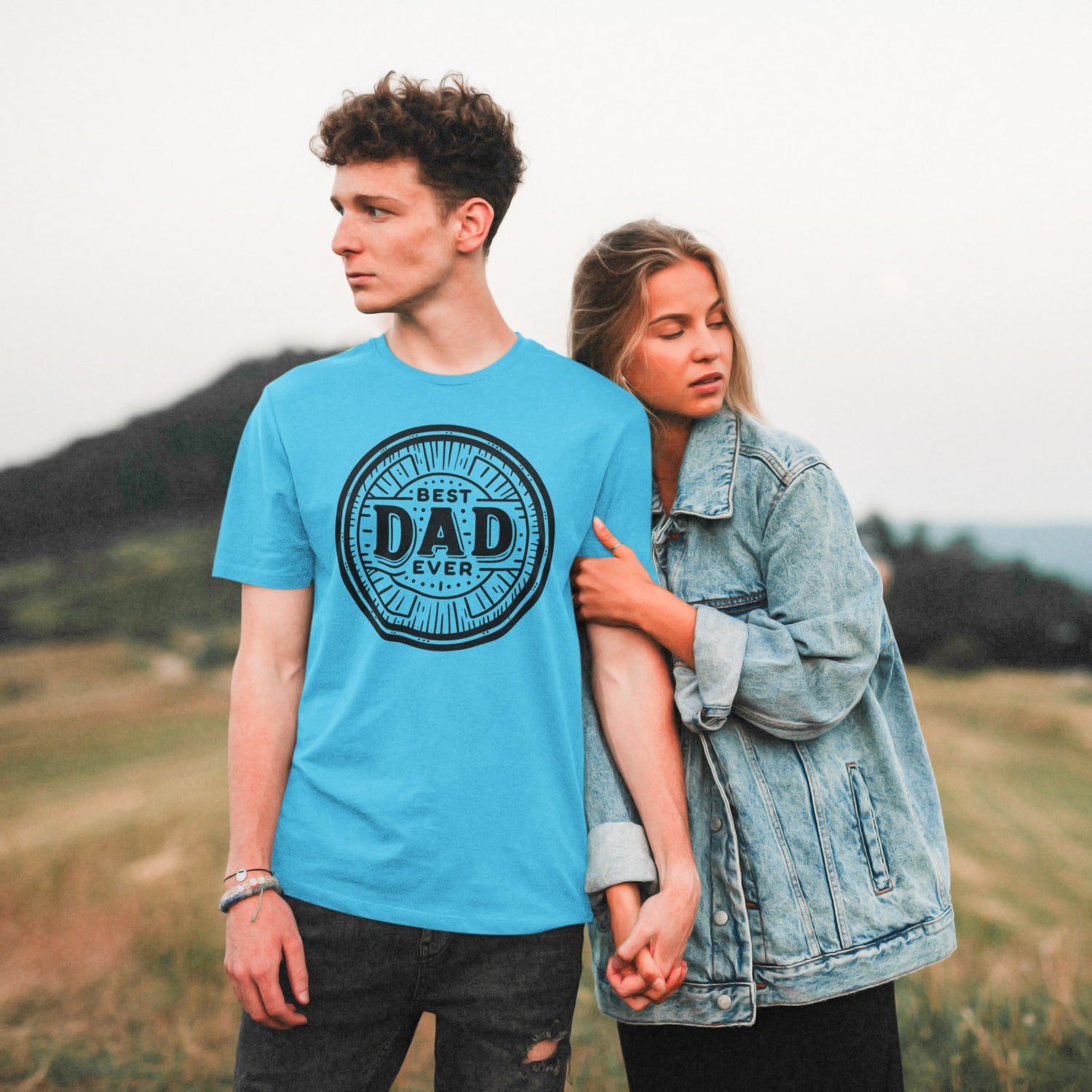 Man wearing a blue t-shirt with &