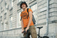 Man wearing an orange t-shirt with &