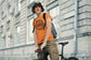 Man wearing an orange t-shirt with &
