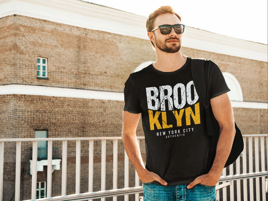 Man wearing a black t-shirt with &