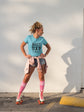 Woman wearing a blue t-shirt with &