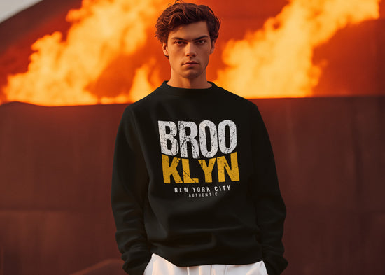 Person wearing a black sweatshirt with &